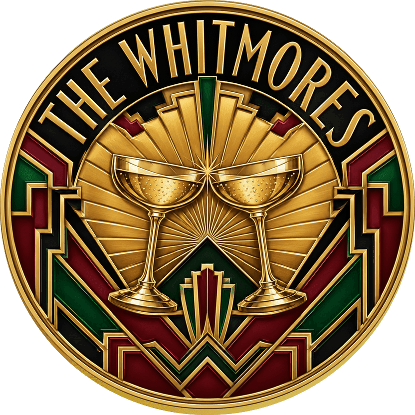 Gold Art Deco wedding coin with champagne coupes at the center of a golden sunburst over black and emerald lacquer panels, reading THE WHITMORES