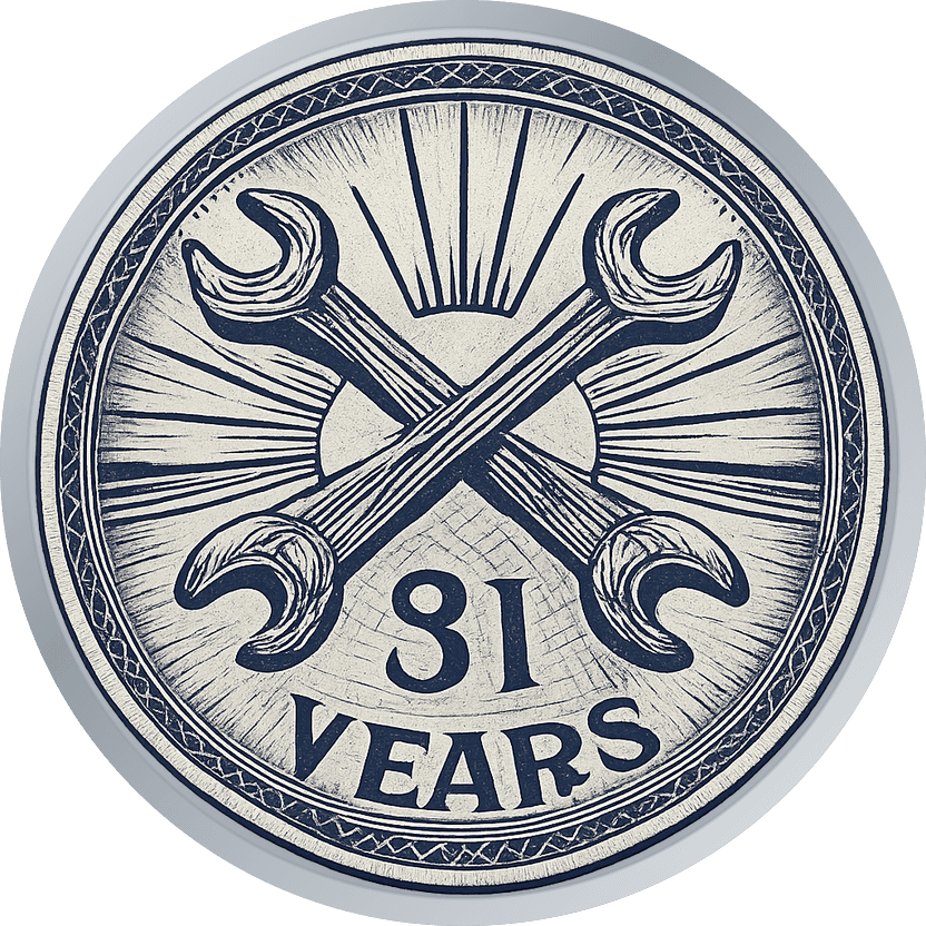 Silver retirement coin with crossed wrenches over a rising sun, engraved style, reading 31 YEARS