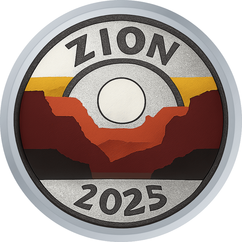 Silver park-badge style coin with layered canyon silhouettes and a bare-metal sun, reading ZION 2025